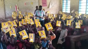 Hon. Nambozo Florence Mayoga’s Kindness Ignites Hope in Sironko As School Children Are Distributed Books